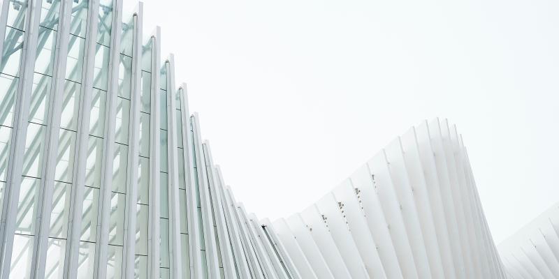 A curved building consisting of direct election beams.